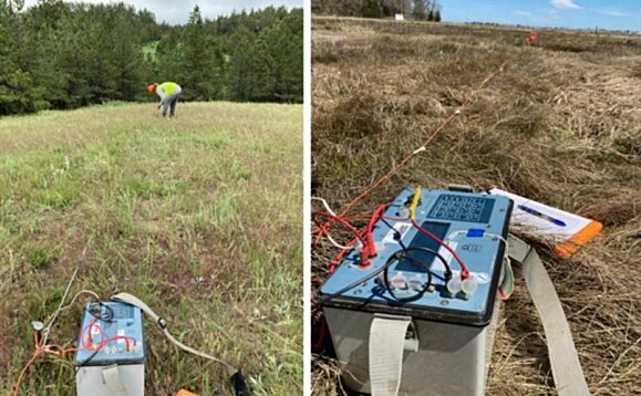 Workers in the field performing a soil resistivity test