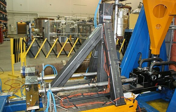 Metal component mounted onto a random input motion table for testing