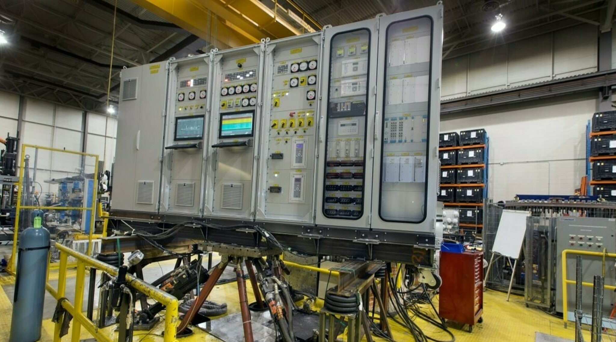 A seismic table with a large control panel mounted onto it ready for testing