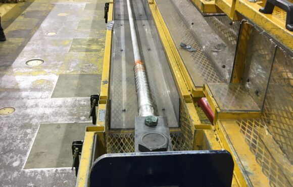 Photograph of lengthy equipment used during pullout tensile strength tests