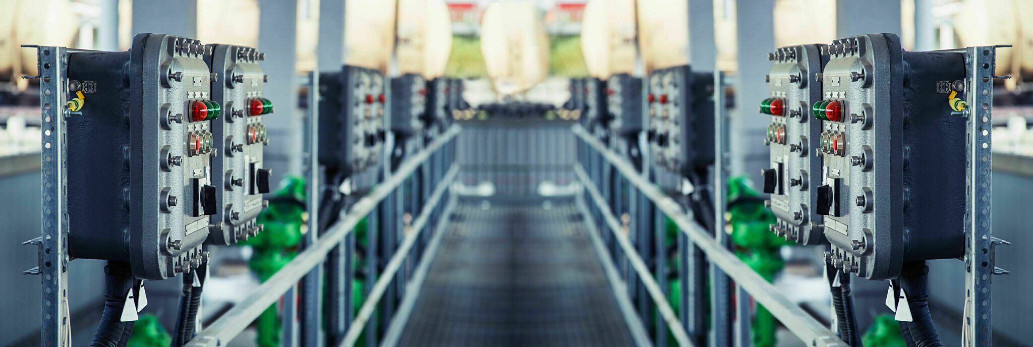 Electronic control systems lining both sides of a walkway