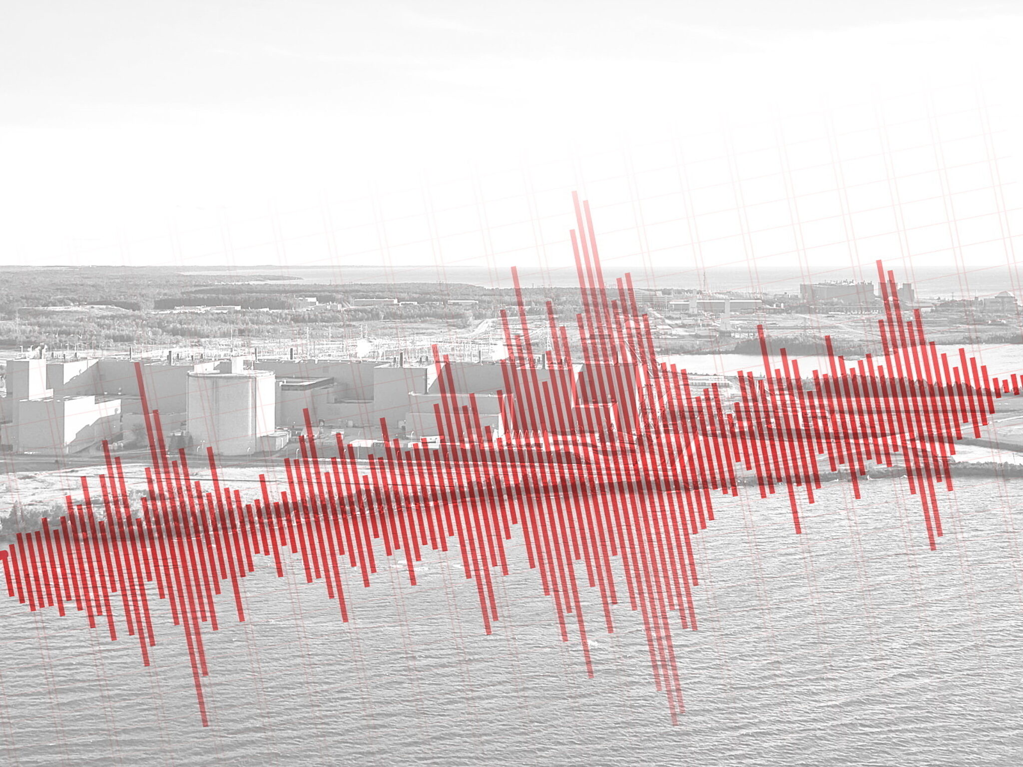 A seismic chart overlaid on top of a picture of a nuclear plant