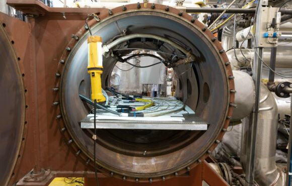 Closeup of large nuclear component attached to monitoring equipment