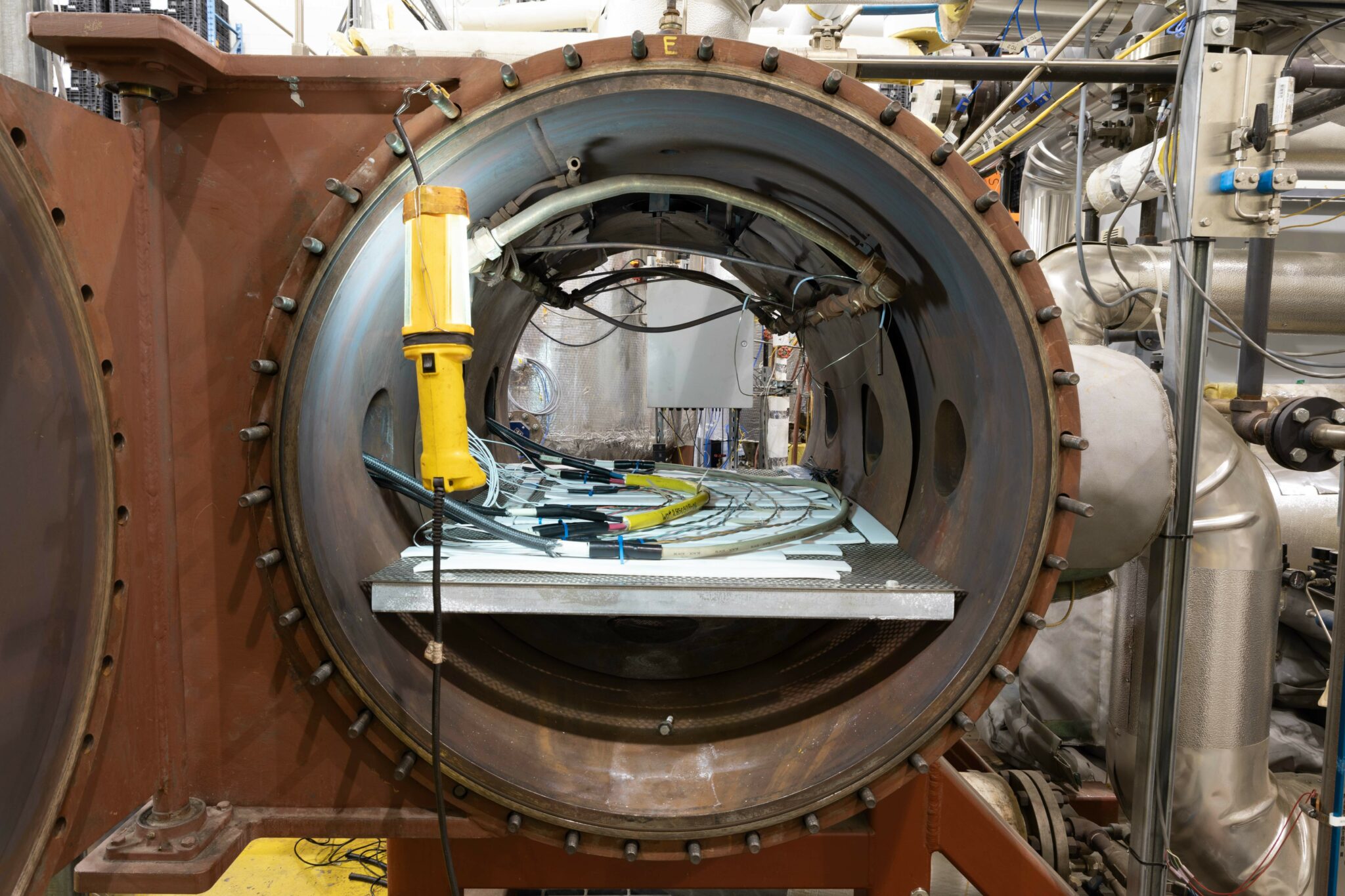 Closeup of large nuclear component attached to monitoring equipment