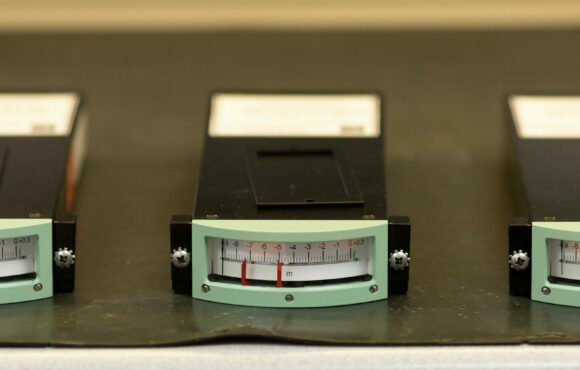 Closeup photograph of three meters that have been reverse engineered