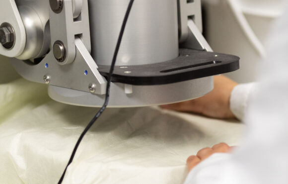 Closeup of surgical gown undergoing testing