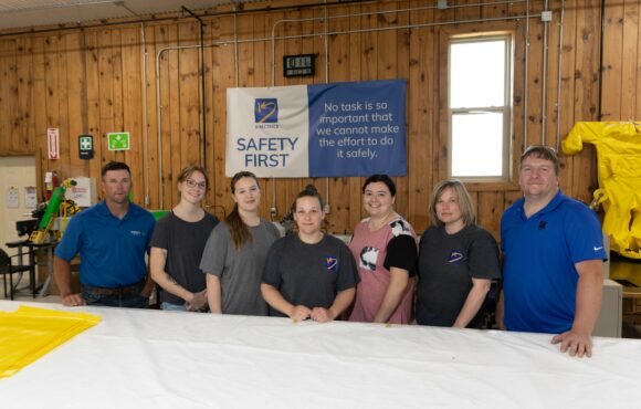 Team photograph of personal protective equipment workers