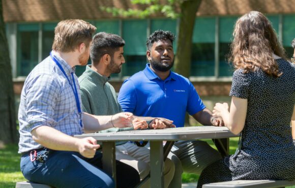 Kinectrics staff chatting outside