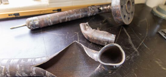 Forensics table featuring worn and burst pipes