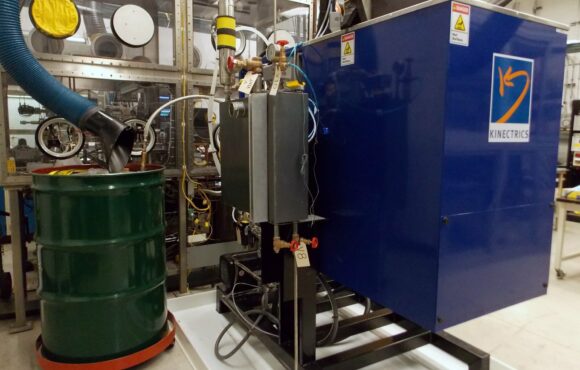 Storage container attached to large testing machinery