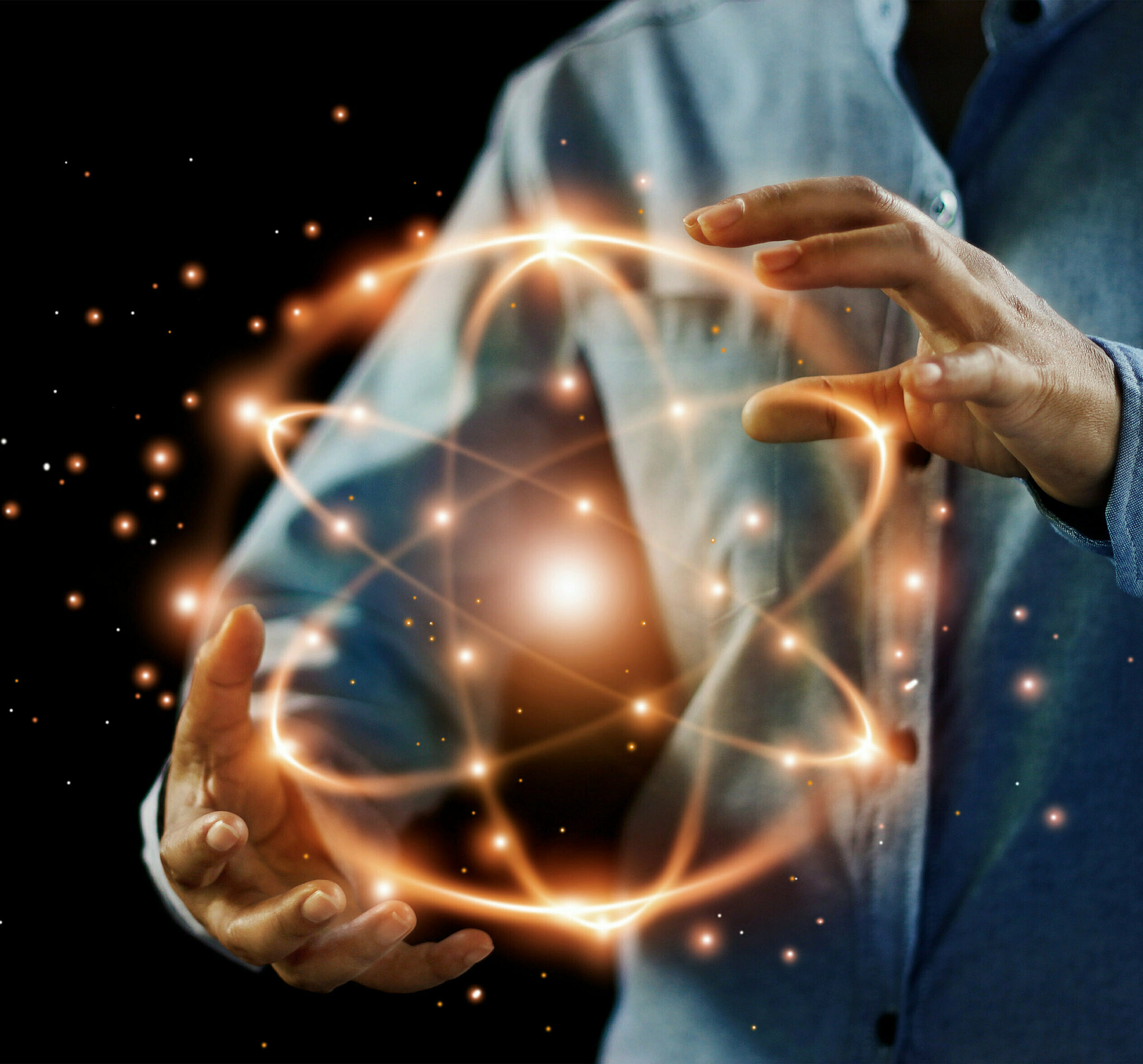 Abstract art of a worker holding an sparkling atomic symbol