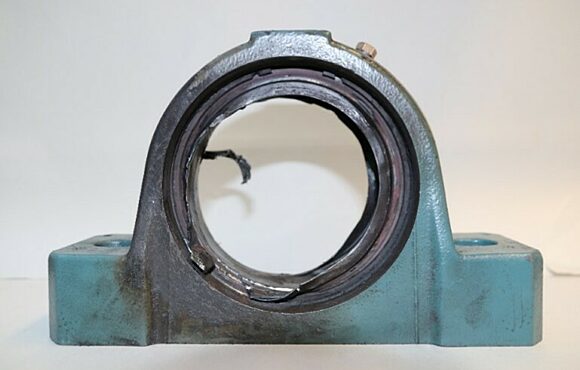 Closeup photograph of a worn machine part