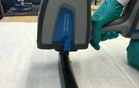 Worker scanning a piece of cable