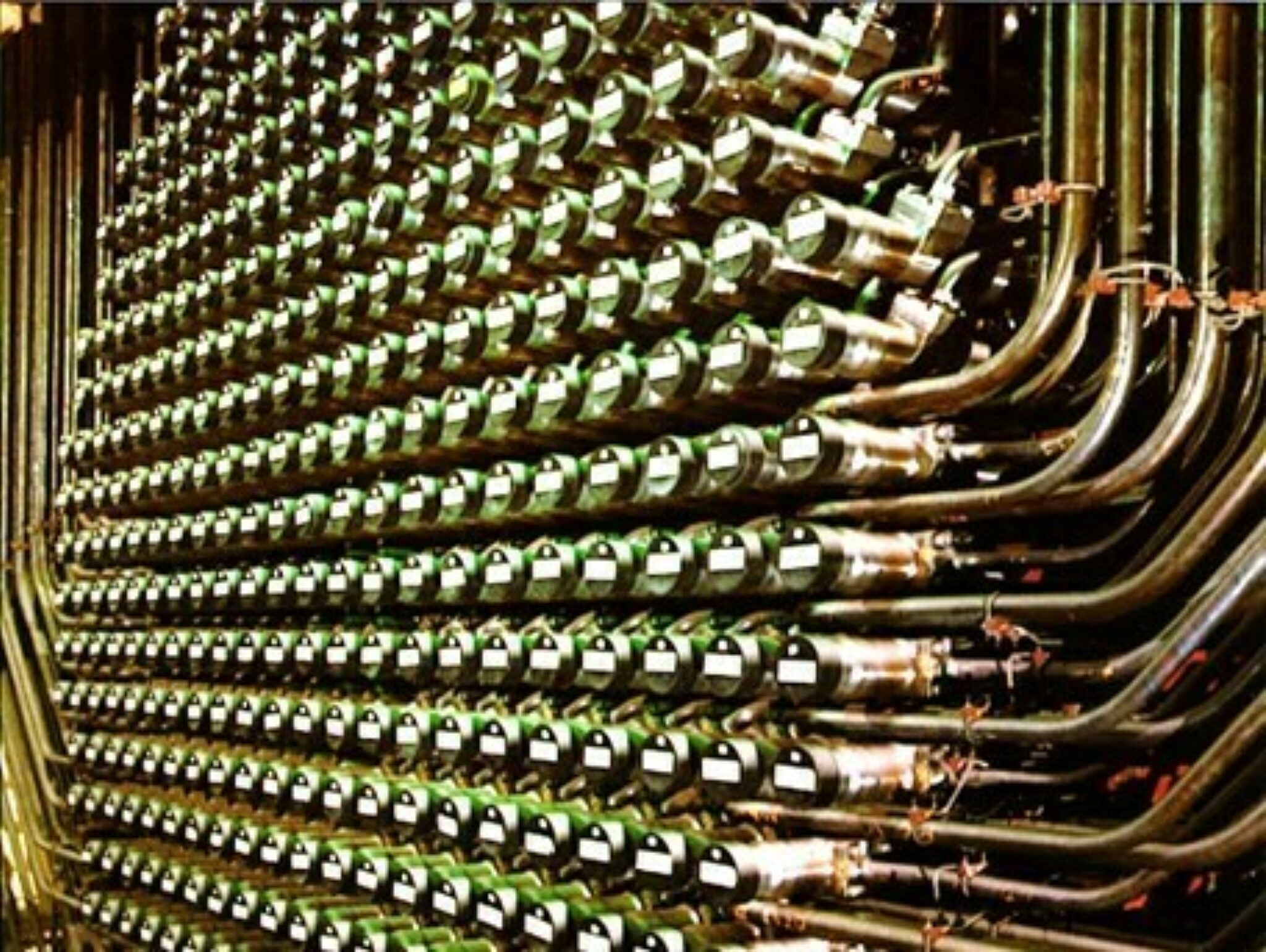 A CANDU reactor face showing the fuel tubes and feeders