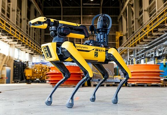 Photograph of Kinectrics' KANINE robot standing idle in a testing facility