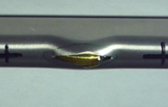 Burst test of a steam generator tube containing an engineered flaw to determine structural margins to failure