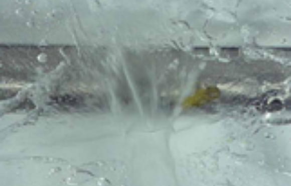 Burst test of a steam generator tube containing an engineered flaw to determine structural margins to failure